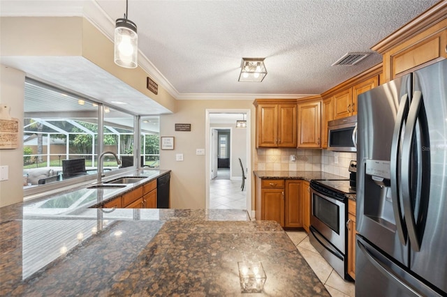 kitchen featuring stainless steel appliances, crown molding, tasteful backsplash, and light tile patterned floors