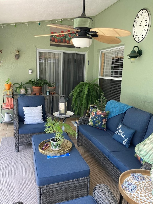 view of patio / terrace featuring ceiling fan and an outdoor living space