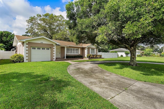 ranch-style home with a garage and a front yard