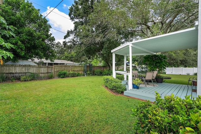 view of yard featuring a deck