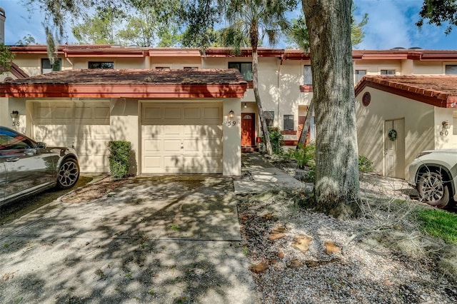 townhome / multi-family property featuring a garage