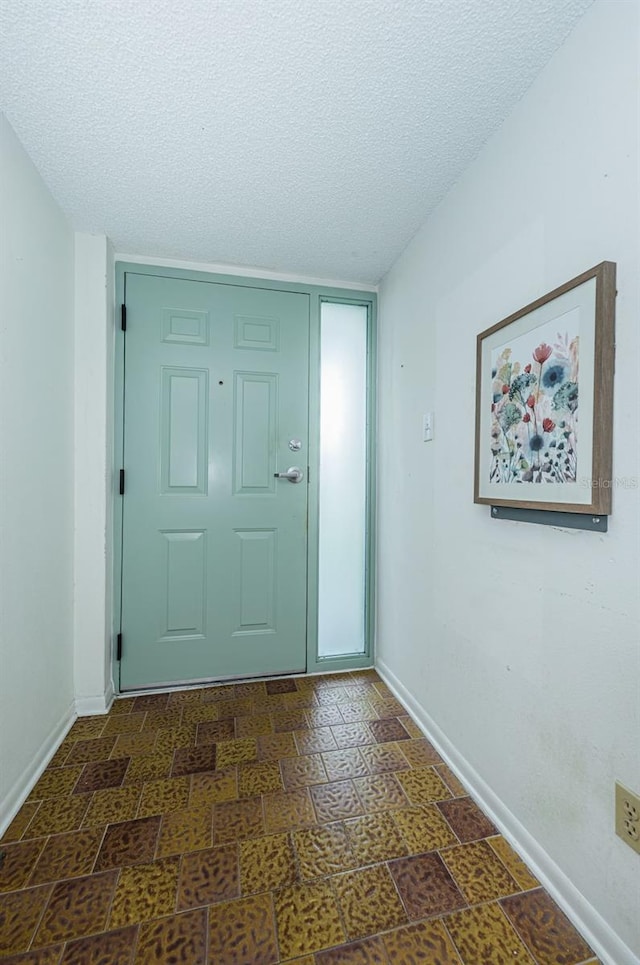 foyer featuring a textured ceiling