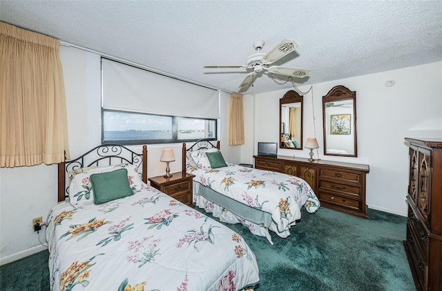 carpeted bedroom with a textured ceiling and ceiling fan