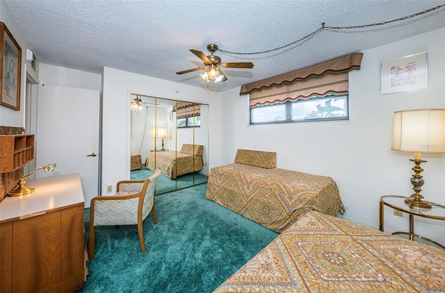 bedroom with a textured ceiling, a closet, dark carpet, and ceiling fan