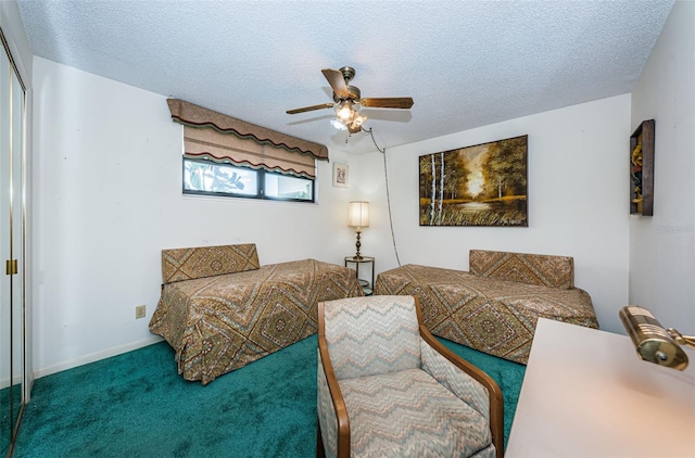 bedroom with a textured ceiling, ceiling fan, and carpet flooring