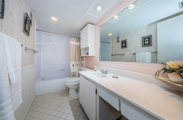 full bathroom featuring toilet, vanity, tile patterned flooring, and shower / bath combination with curtain