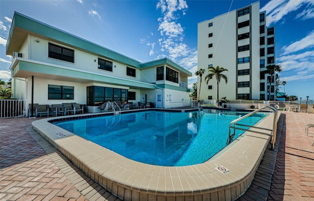 view of swimming pool featuring a patio