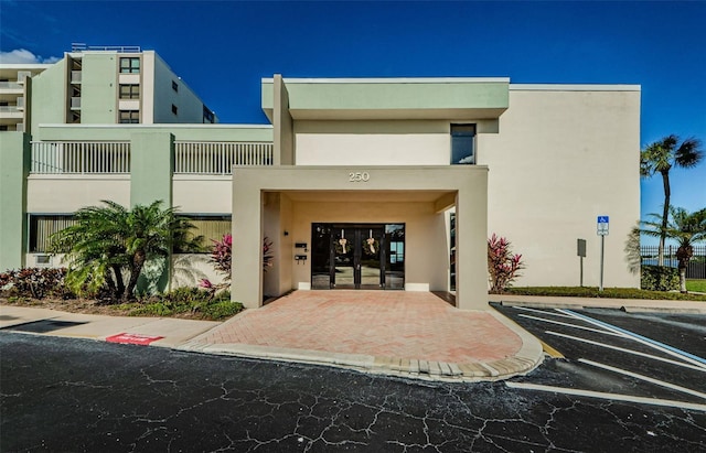 300 Woodette Dr Unit 202B, Dunedin, FL 34698 - view of property featuring uncovered parking