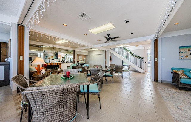300 Woodette Dr Unit 202B, Dunedin, FL 34698 - dining space featuring stairs, light tile patterned flooring, ceiling fan, and recessed lighting