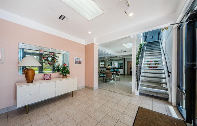 300 Woodette Dr Unit 202B, Dunedin, FL 34698 - entrance foyer with stairway and light tile patterned floors