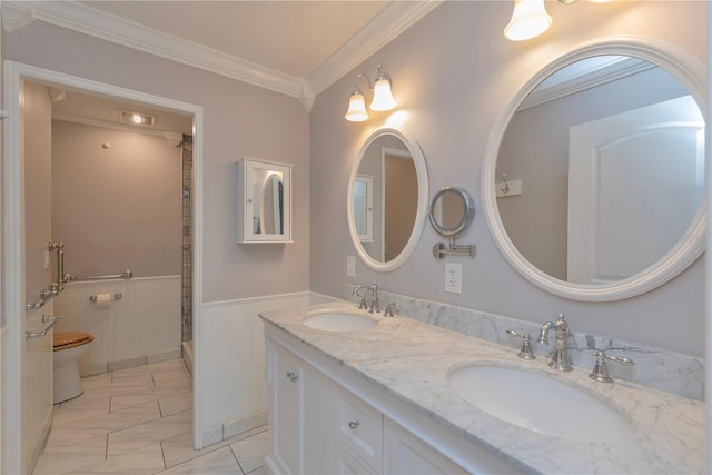 bathroom featuring tile patterned floors, ornamental molding, toilet, and dual bowl vanity