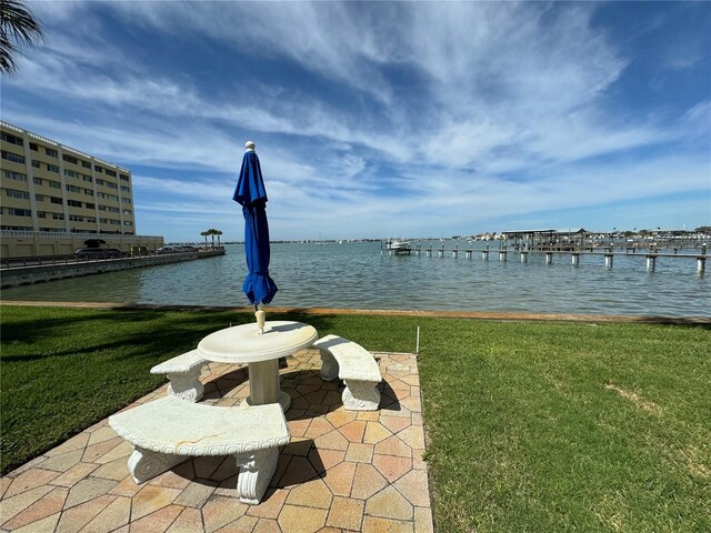 exterior space with a lawn and a water view