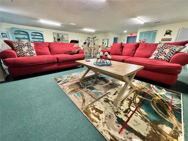 carpeted living room featuring a textured ceiling