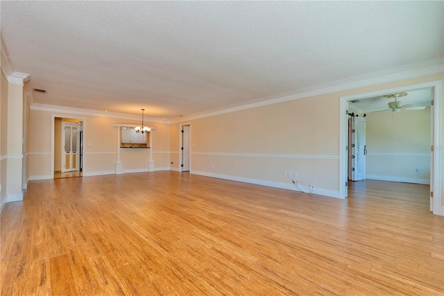 unfurnished living room with light wood-type flooring, ceiling fan with notable chandelier, ornamental molding, and a textured ceiling