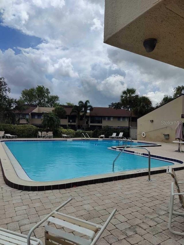 view of pool featuring a patio