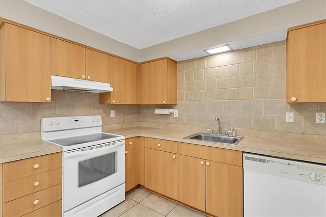 kitchen featuring tasteful backsplash, sink, white appliances, a textured ceiling, and light tile patterned floors