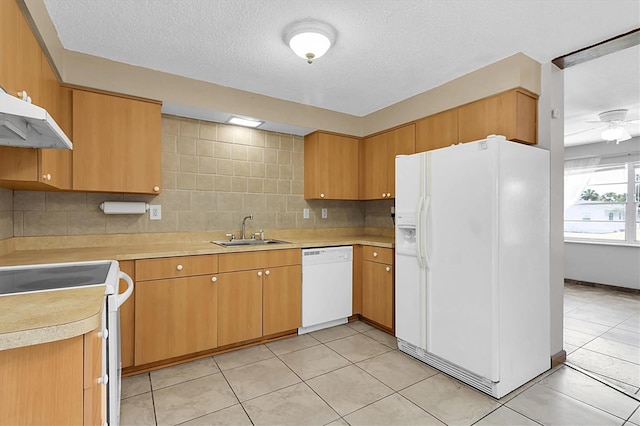 kitchen with ceiling fan, backsplash, sink, white appliances, and light tile patterned flooring