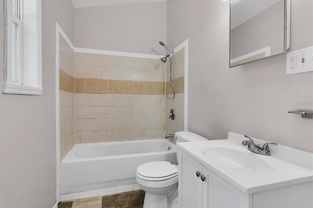 full bathroom with tile patterned floors, toilet, vanity, and tiled shower / bath combo