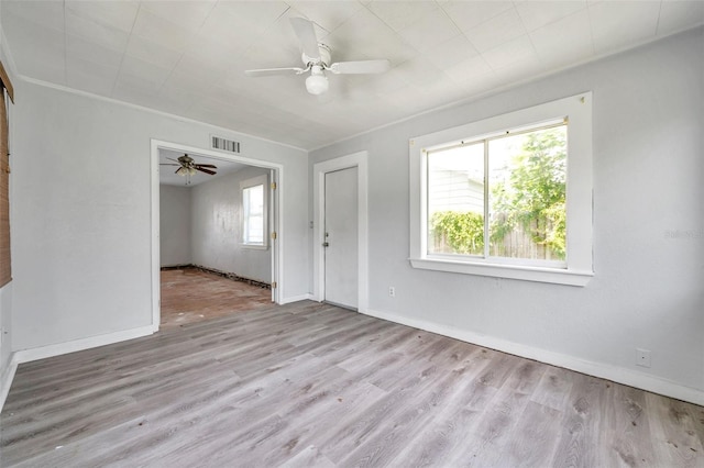 unfurnished room featuring ceiling fan, light hardwood / wood-style floors, and a wealth of natural light