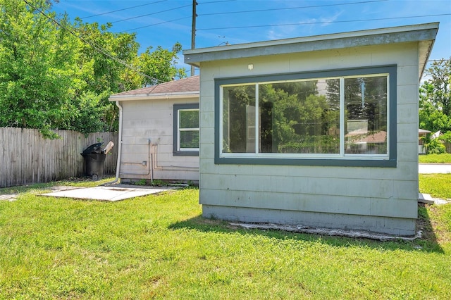 view of home's exterior featuring a yard