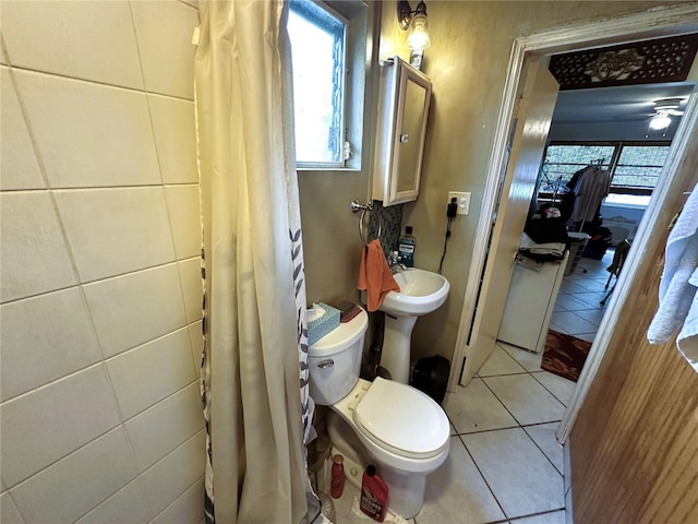 bathroom featuring ceiling fan, toilet, and tile patterned floors