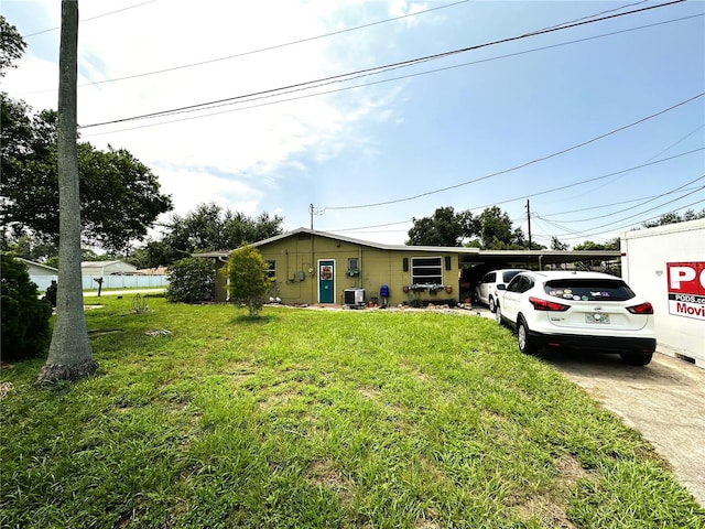 view of front facade featuring a front lawn and central air condition unit