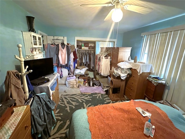 interior space with carpet floors and ceiling fan