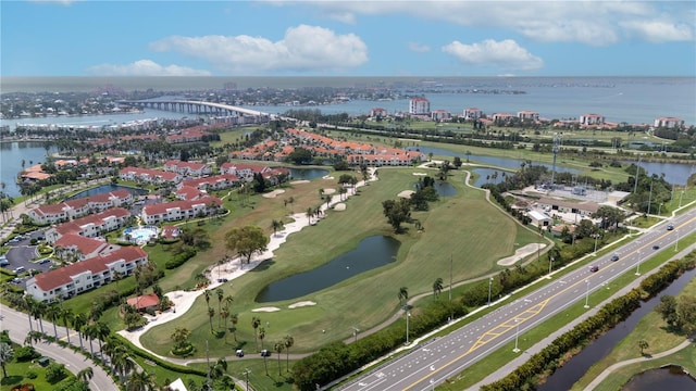 birds eye view of property with a water view, a view of city, and golf course view