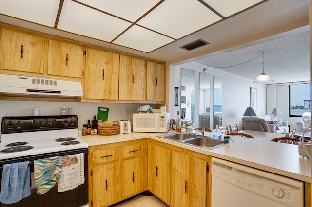 kitchen featuring sink, hanging light fixtures, a textured ceiling, white appliances, and exhaust hood