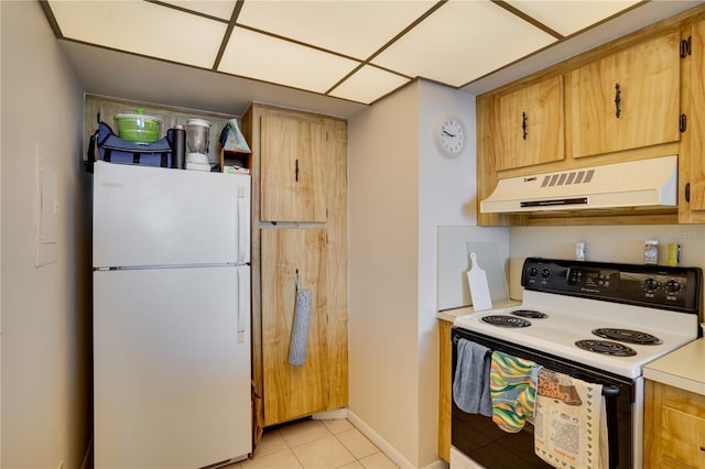 kitchen featuring light tile patterned floors and white appliances