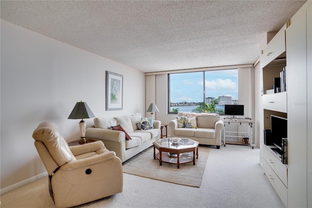 living room with light carpet and a textured ceiling