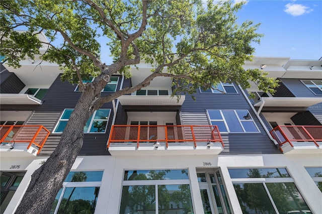 rear view of house with a balcony