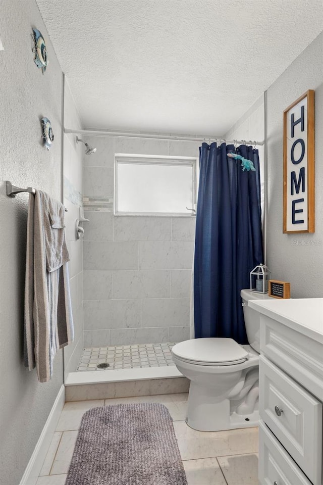 bathroom featuring toilet, a shower with shower curtain, vanity, tile patterned floors, and a textured ceiling