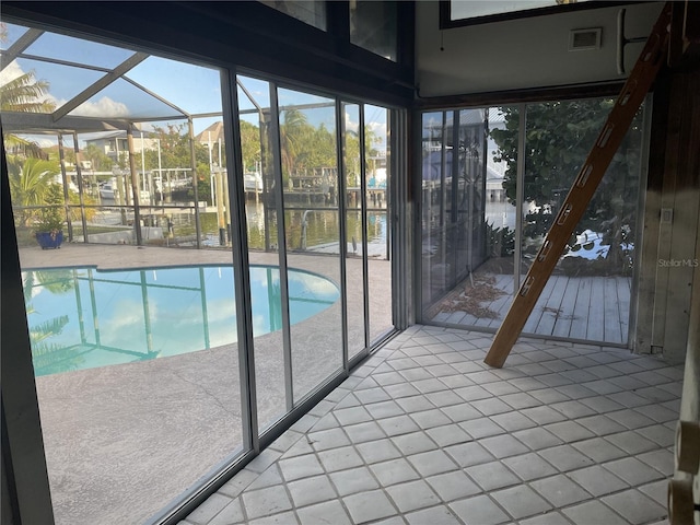 view of swimming pool with a water view