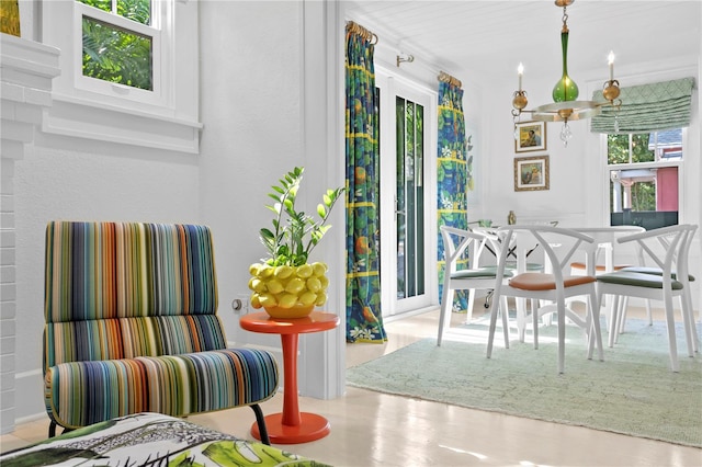 dining area with wood-type flooring and plenty of natural light