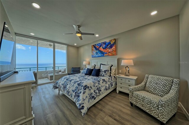 bedroom with access to outside, floor to ceiling windows, wood-type flooring, and ceiling fan