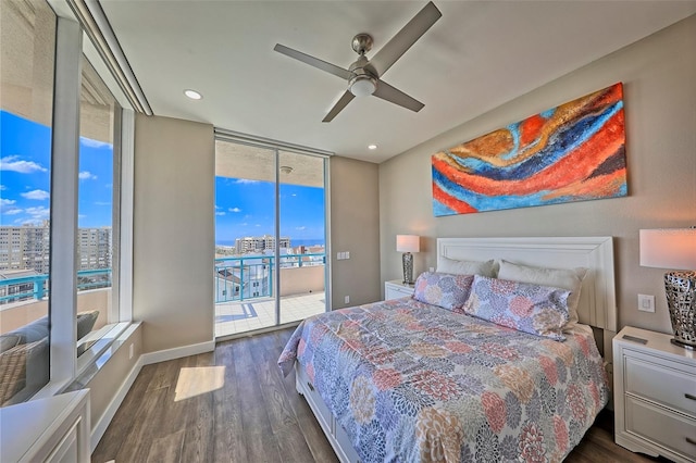 bedroom with ceiling fan, floor to ceiling windows, dark hardwood / wood-style floors, and access to exterior