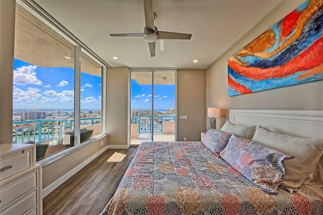 bedroom with ceiling fan, access to exterior, a wall of windows, and dark wood-type flooring