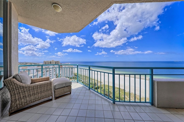 balcony featuring a water view