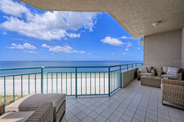 balcony featuring an outdoor hangout area and a water view