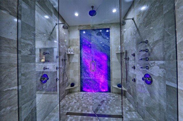 bathroom featuring a shower with door