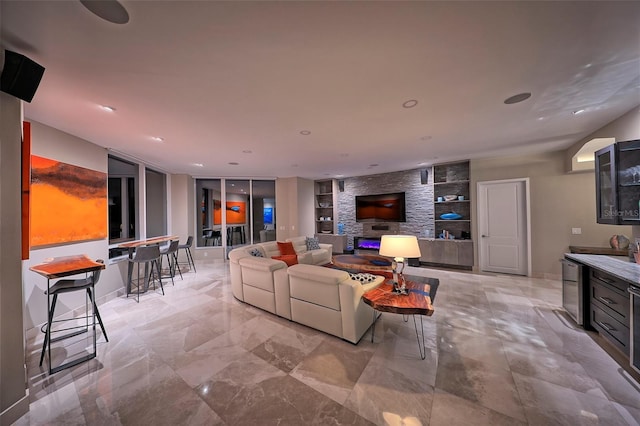 living room featuring built in shelves and light tile patterned floors