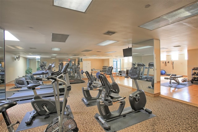 gym with hardwood / wood-style flooring