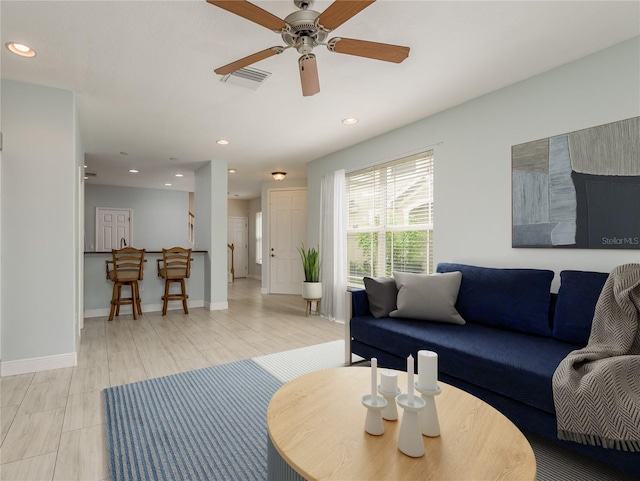 living room with ceiling fan