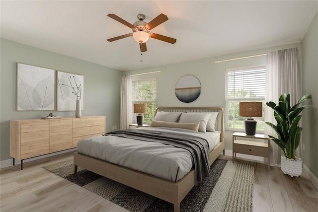 bedroom featuring ceiling fan and light wood-type flooring