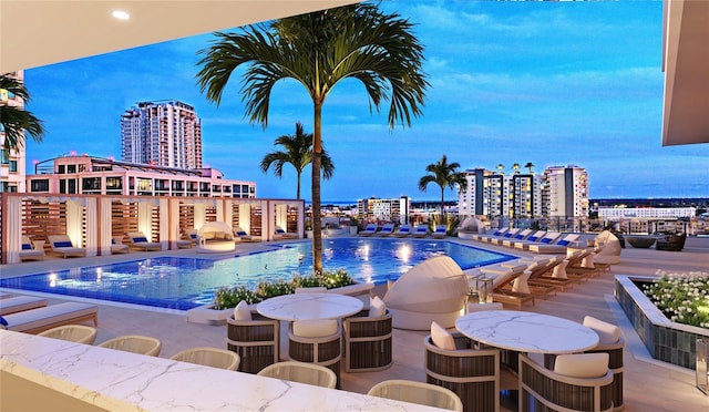 view of pool at dusk