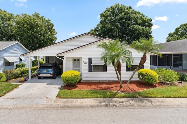 1967 Long Boat Dr, Lakeland, FL 33810 - ranch-style home featuring concrete driveway and a carport