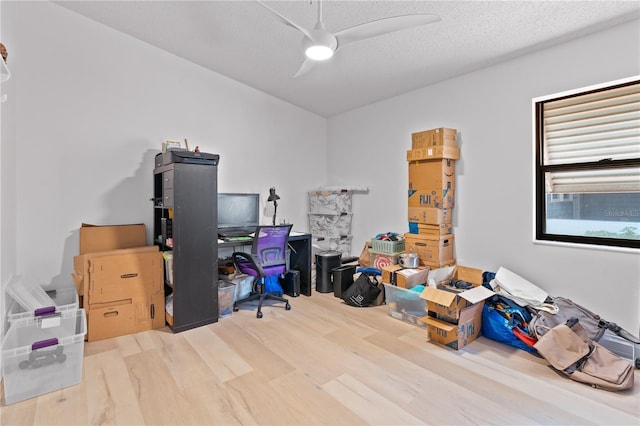 1967 Long Boat Dr, Lakeland, FL 33810 - office area featuring a textured ceiling, ceiling fan, and wood finished floors