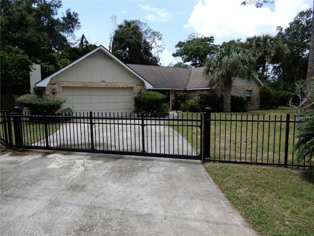 ranch-style home featuring a front lawn and a garage