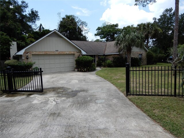 ranch-style house with a front yard and a garage